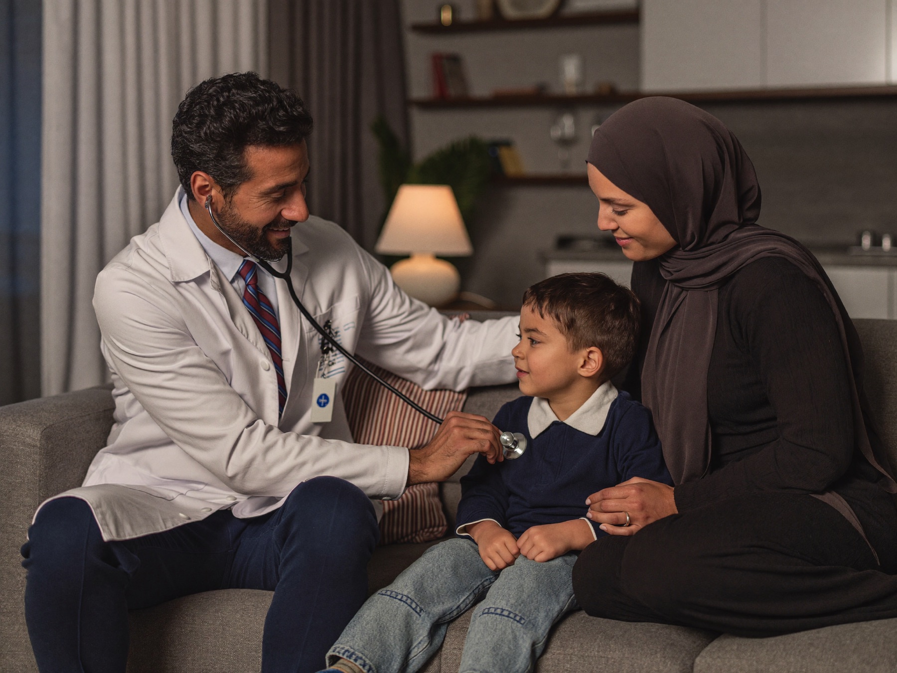 A doctor examining a child at home